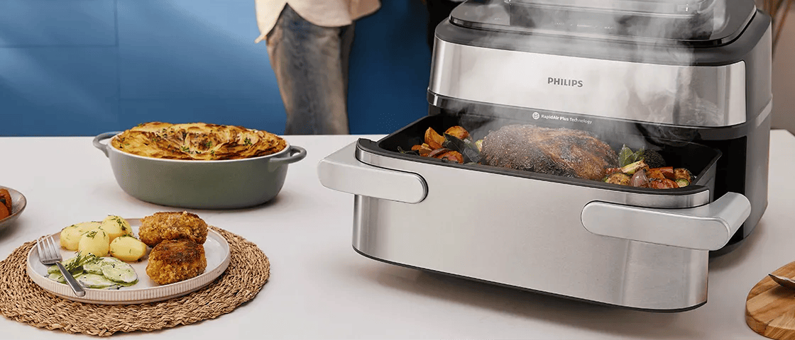 Philips Dual Basket Airfryer ve stylové šedé barvě, prezentován v moderní kuchyni. Vlastnosti: technologie RapidAir, nastavení rodinného jídla, uživatelsky přívětivé dotykové ovládání.