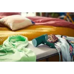 Garment Care Simba Handheld-Steamer Product In Use Photo (PPL) STH3020_10 (Dark Green color) V0.tif. RGB Garment Care Simba Handheld-Steamer Product In Use Photo (PPL) STH3020_10 (Dark Green color) V0.tif. RGB