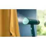 Garment Care Simba Handheld-Steamer Main in-use photograph (PPL) STH3020_10 (Dark Green color) V0.jpg. RGB Garment Care Simba Handheld-Steamer Main in-use photograph (PPL) STH3020_10 (Dark Green color) V0.jpg. RGB